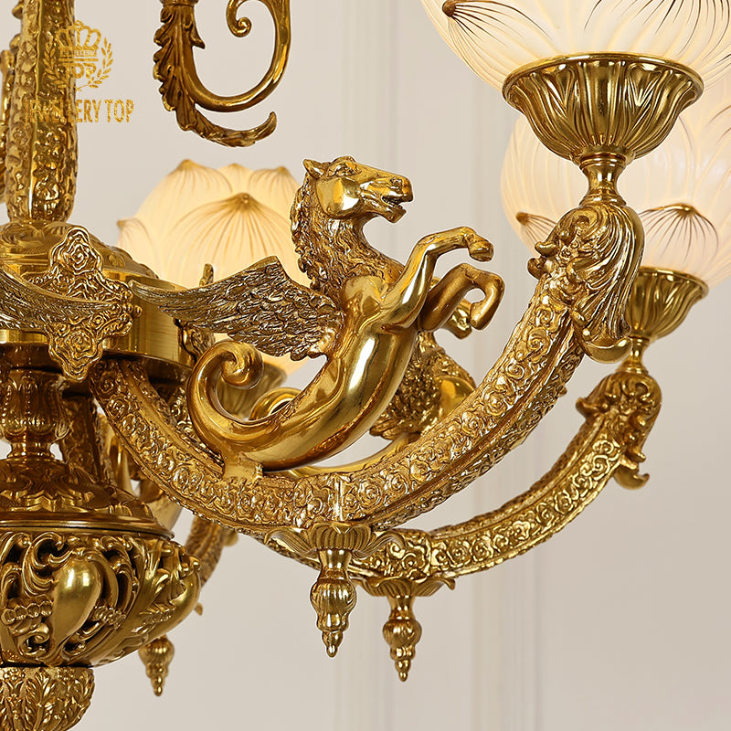 Close-up of Pegasus detail on brass chandelier arm, highlighting intricate craftsmanship.