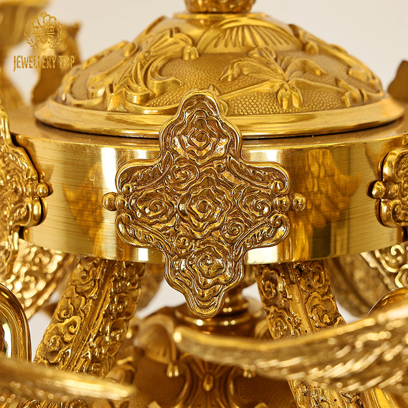 Regal brass column of the Pegasus Glory chandelier with detailed leaf motifs.