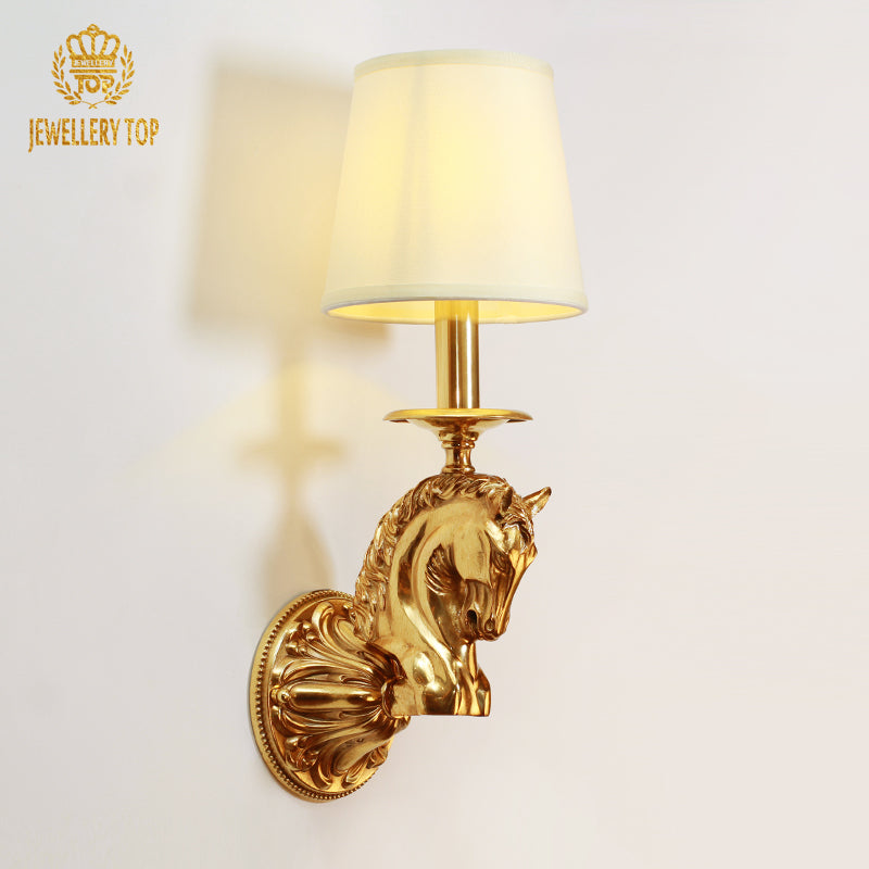 Frontal view of the Regal Stallion brass wall sconce featuring a horse head motif