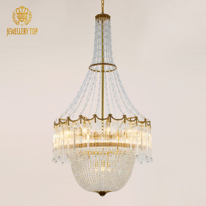 Rococo chandelier with brass frame and cascading glass crystals.