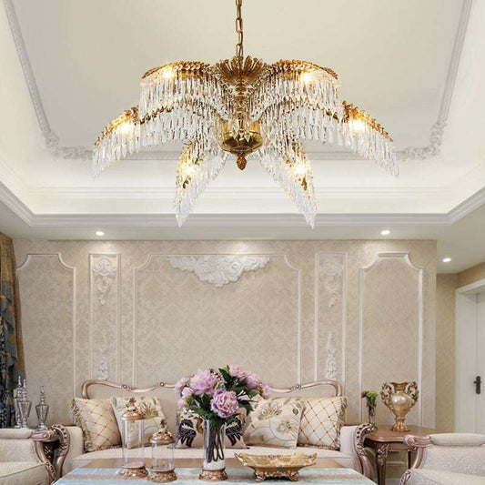 Softly glowing tropical chandelier with palm leaf design, casting a warm, inviting light.