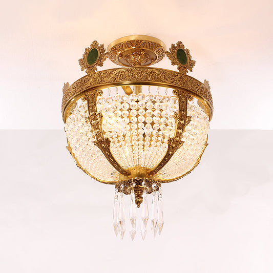 Luxurious crystal beadwork and pendant accents on brass ceiling light.