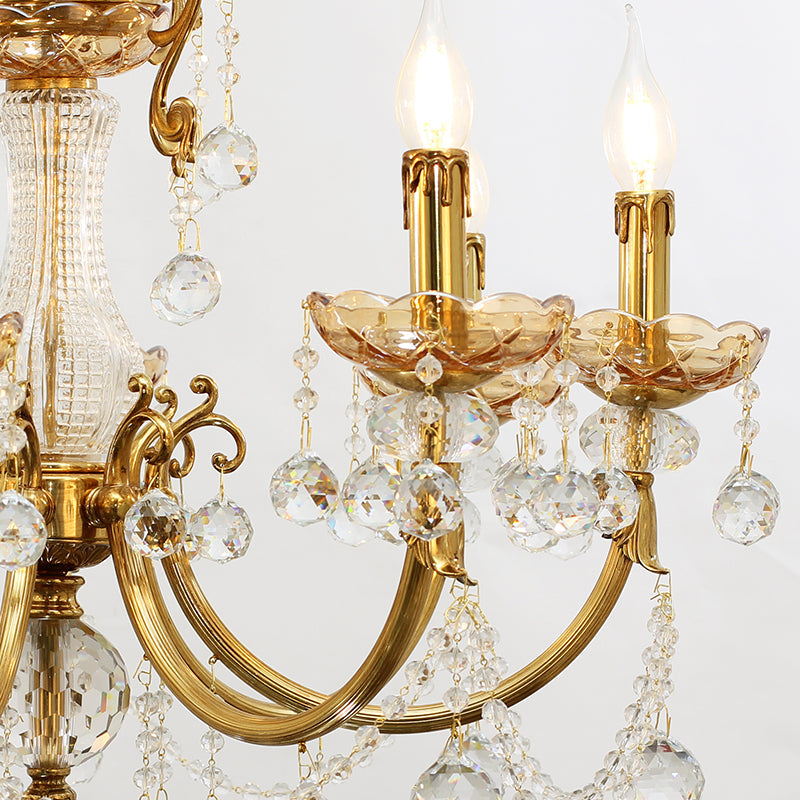 Elegant candle‑style LED holders surrounded by faceted crystals on chandelier.