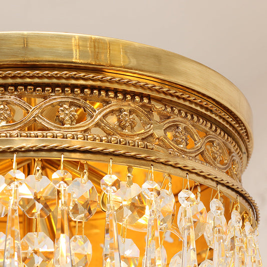 Close-up of brass and crystal vintage flush mount ceiling light