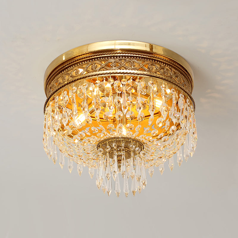 Elegant antique ceiling light with crystal drops and brass base