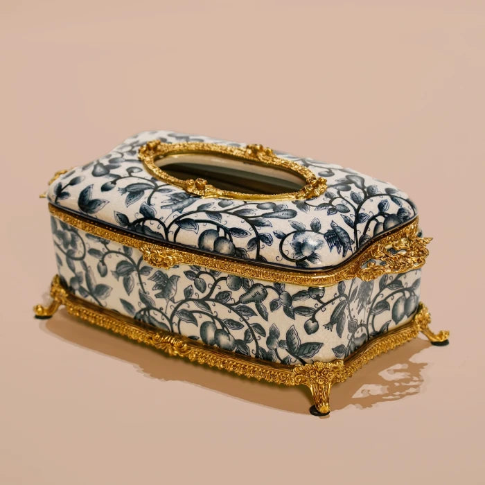 Decorative tissue box showcasing European-style botanical patterns and golden feet