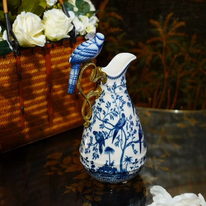 Close-up of blue and white porcelain decorative vase with tree and bird motifs