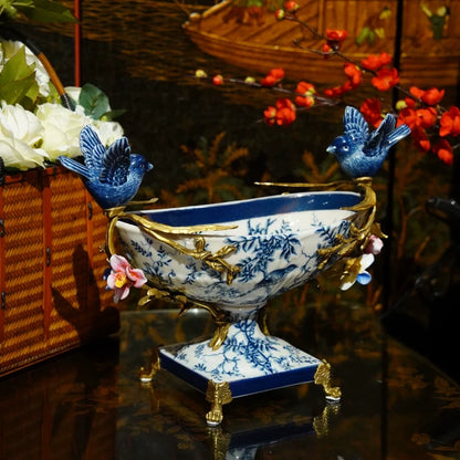 Close-up of blue nightingale pattern on white ceramic tray with floral branches