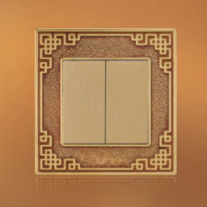 Brass wiring device with ornate border and multi-function socket outlet