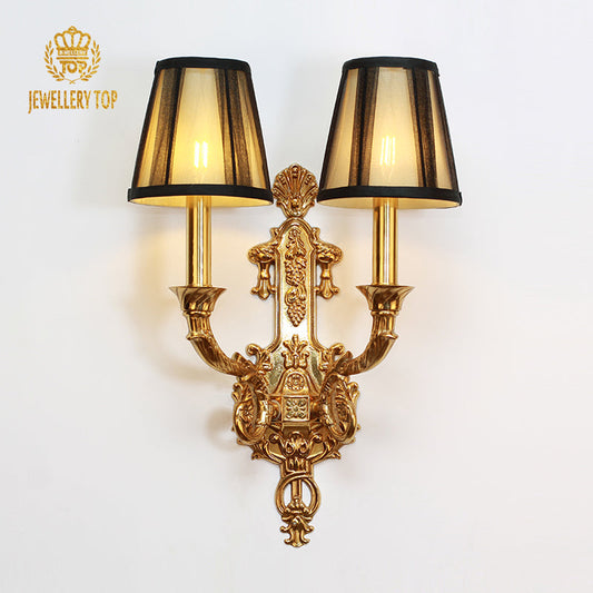 Frontal view of the Aria Regal sconce showing brass arms and fabric shades