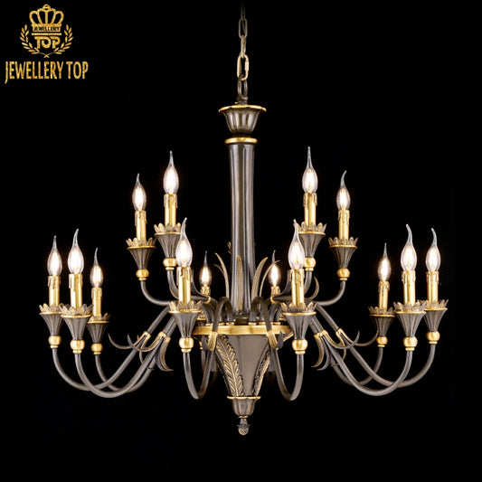 Close-up detail of the ornate, curved brass arms and flickering candle-style bulbs on a living room chandelier.