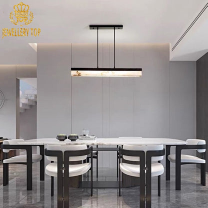 Minimalist dining area showcasing the Aurelian Beam’s warm glow