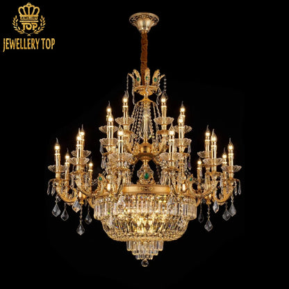 Luxury french chandelier featuring emerald - accented crystal drops and ornate brass framework