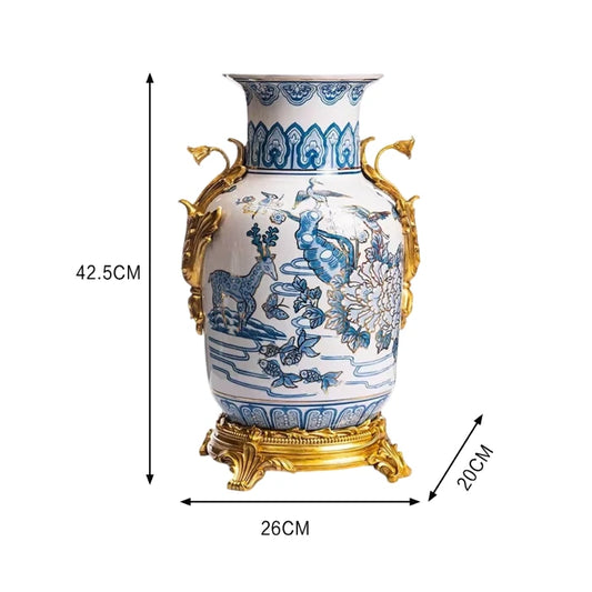 Decorative vase showcasing intricate brass dragon handles and a tiered brass base.