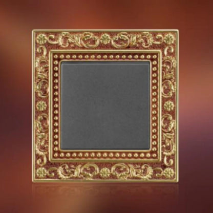 Brass wiring device with carved border and European-style socket outlet