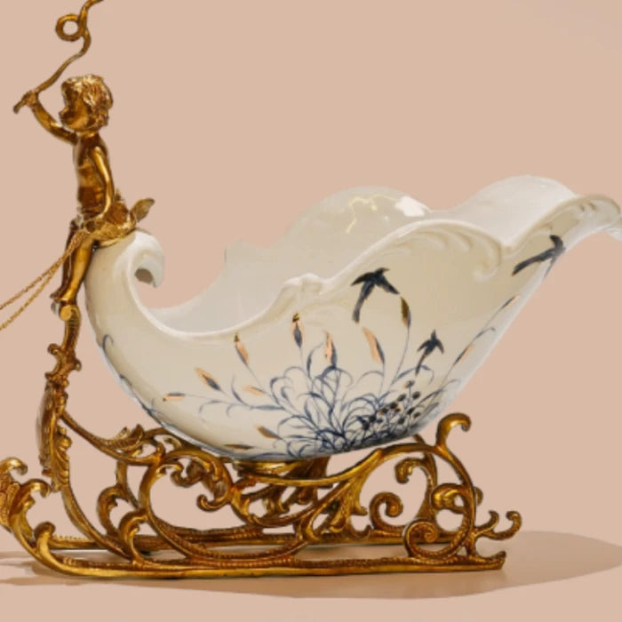 European-style ornament with cherub figure and intricate brass scrollwork base