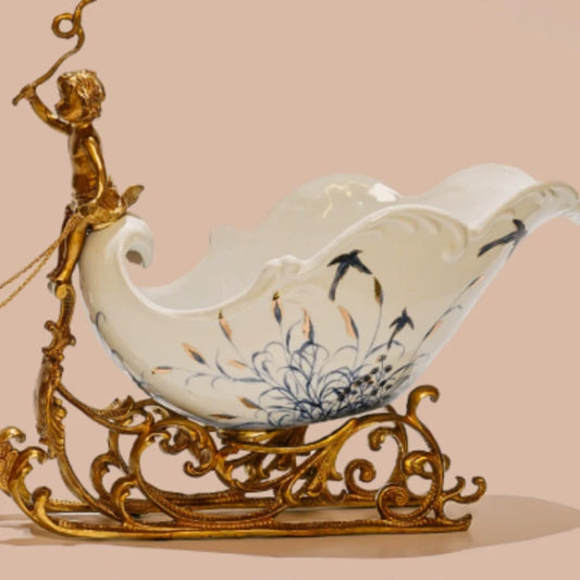 European-style ornament with cherub figure and intricate brass scrollwork base