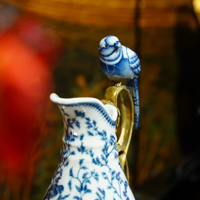 Side view of creative design ceramic vase placed on a table with botanical backdrop