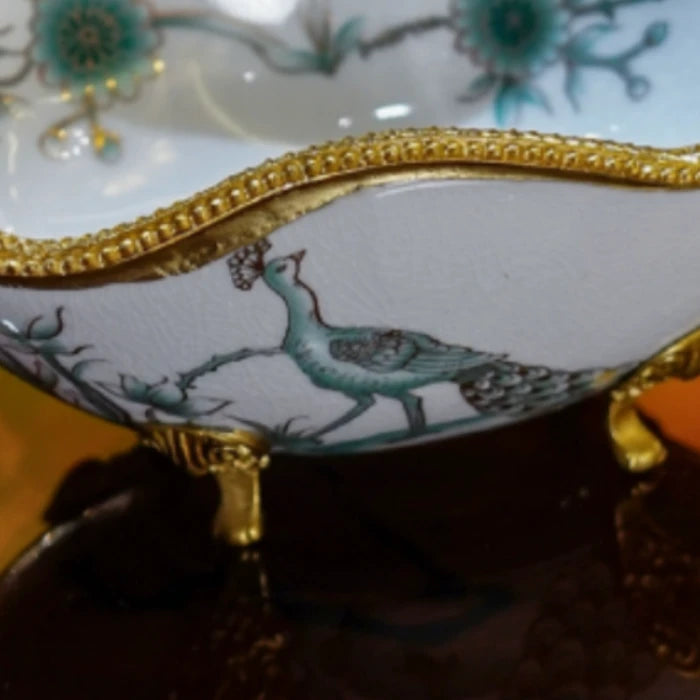 Decorative dish used as a serving tray with pastries against a dark backdrop