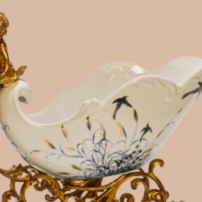 Brass ornament showcasing stag and celestial cherub in dynamic motion