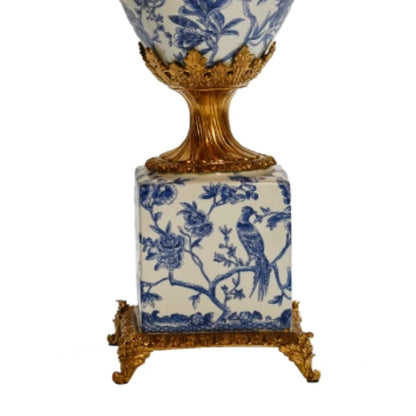 Side profile of an art design flower vase highlighting its elegant brass handle and full ceramic body artwork.