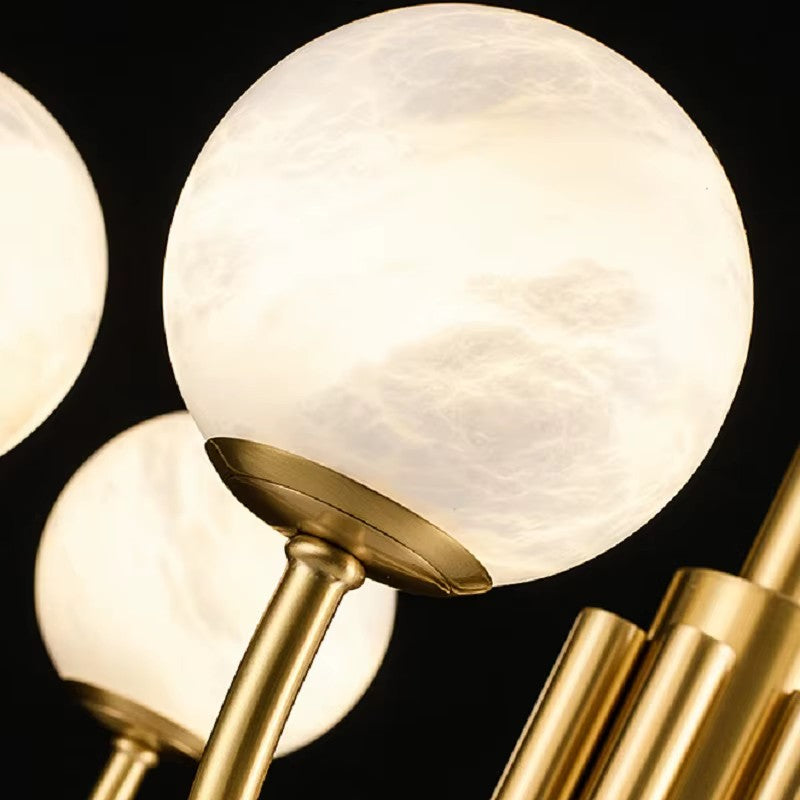 Soft diffused light from translucent alabaster spheres creating warm ambiance