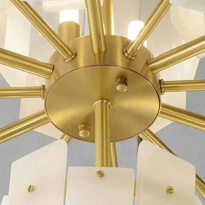 Close-up of modern chandelier’s brass framework and polished finish