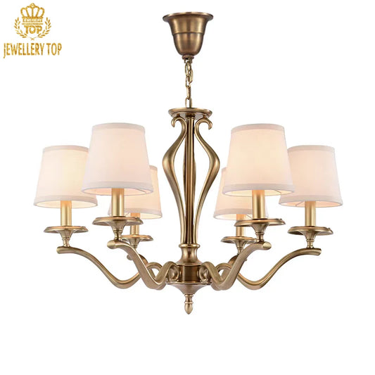Rustic brass pendant light with white shades and scrollwork details