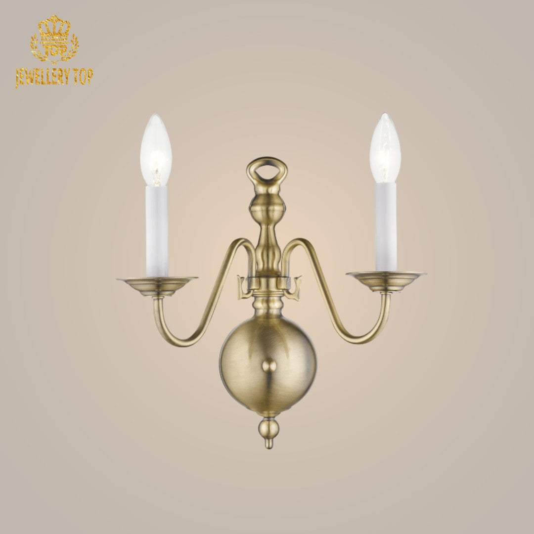 Elegant Georgian wall lamp in polished brass, offering a timeless design.