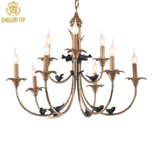 Antique-style brass pendant light with black avian motifs