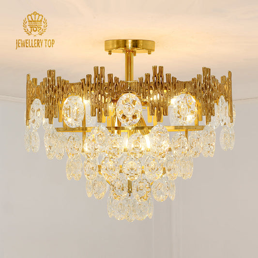 Vintage flush mount ceiling light with brass coral-inspired frame and cascading crystals.