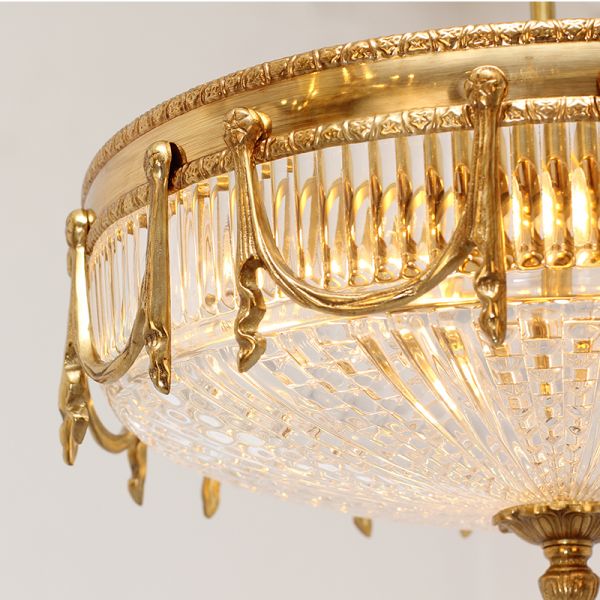 Close-up of antique ceiling light detailing with classical garland motifs.