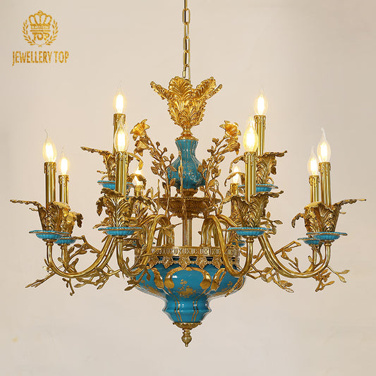 Vibrant azure ceramic chandelier with ornate brass arms and floral accents.