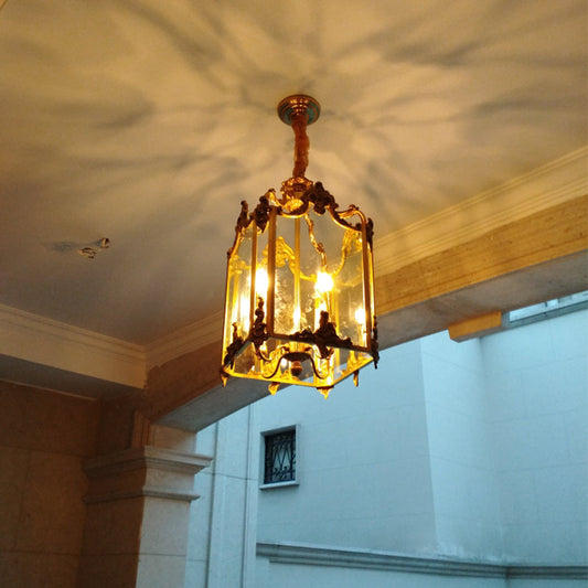 Luce a sospensione antica in ottone