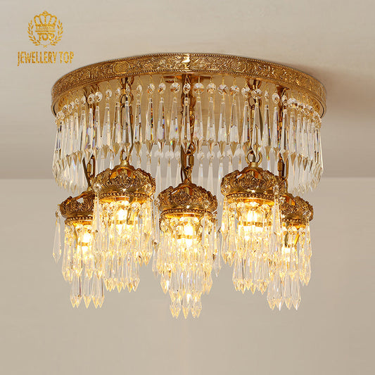 Antique ceiling lights with detailed brass rim and crystal pendants inspired by Cassiopeia.