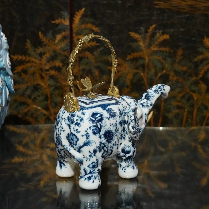 Elephant teapot decorative ornament featuring floral patterns and golden dragonfly detail