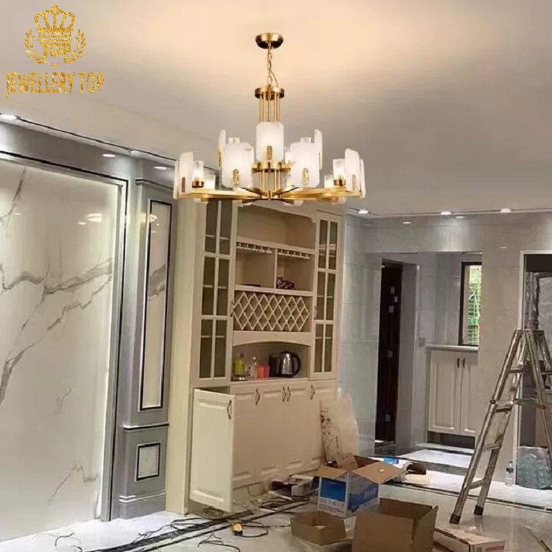 Asymmetrical alabaster chandelier with oxidized brass lattice in a high-ceilinged modernist lounge