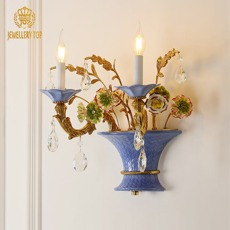  Front view of the Florence Bloom ceramic wall sconce with floral brass arms