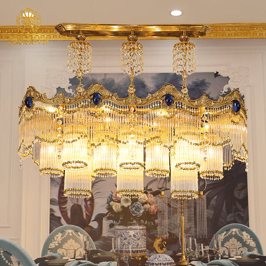 Éclat de Versailles vintage french chandelier with brass arms and crystal droplets.
