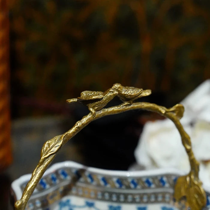 Close-up of handcrafted brass lattice work on decorative orb basket