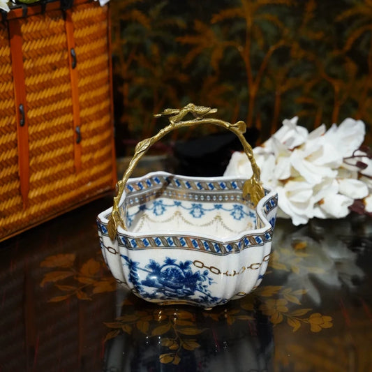 Brass bird-shaped handle perched atop the vintage Chinese ceramic ornament.