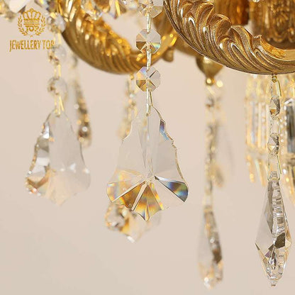 Sunburst crystal refraction on Neoclassical brass chandelier arms
