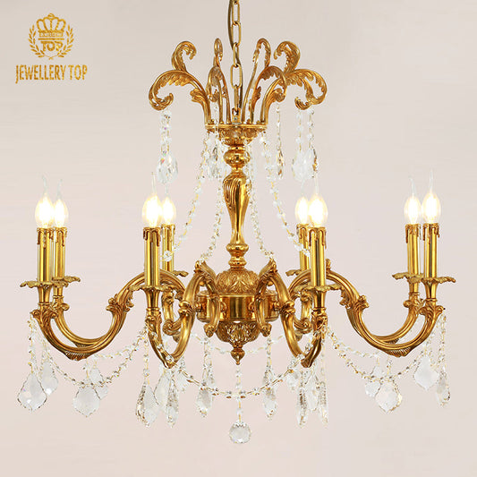 Vintage bronze chandelier with curved arms and sparkling crystal droplets.