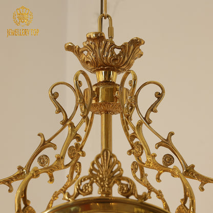 Close-up of the elegant brass top and floral accents of the Georgian style lighting pendant.