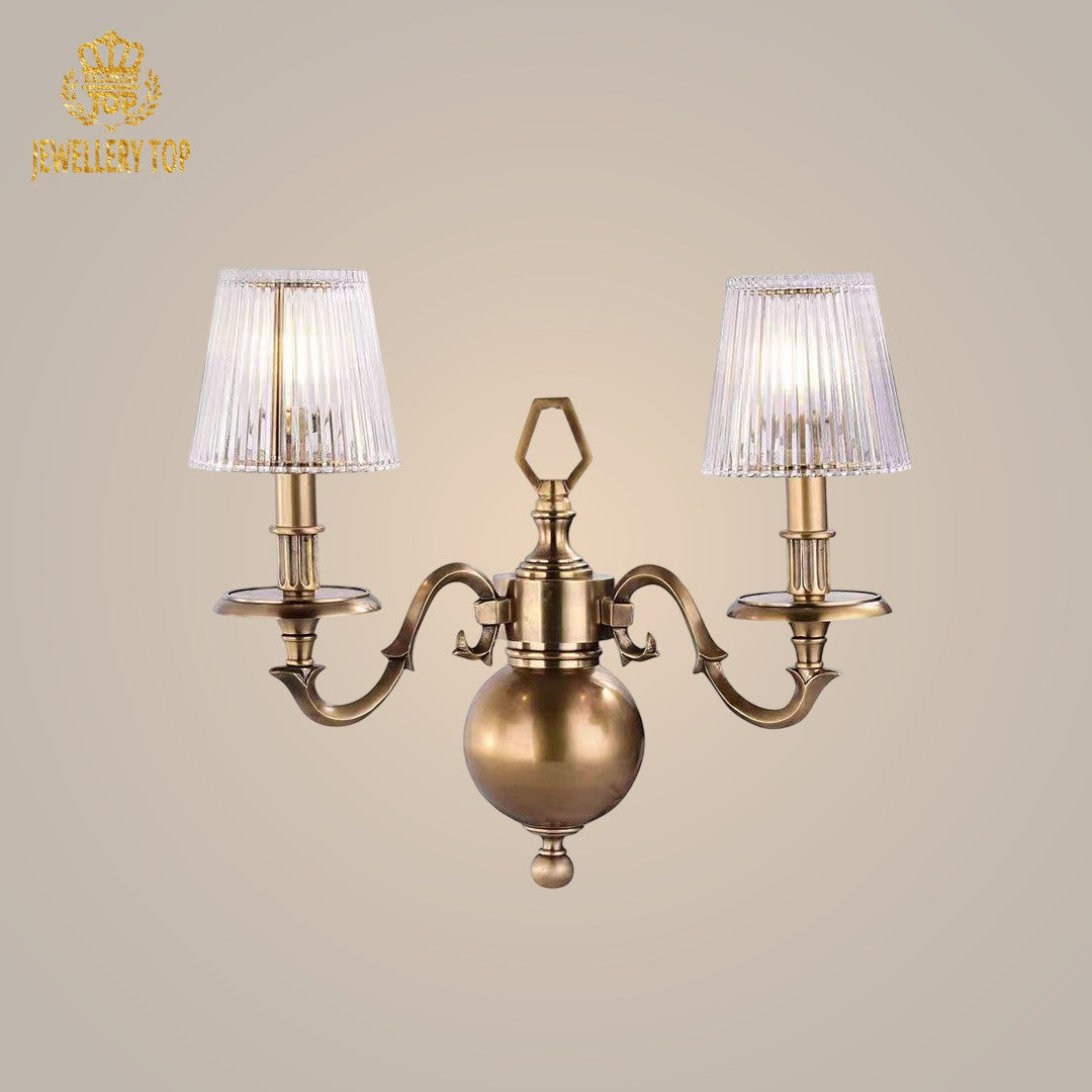 Elegant Georgian sconce with brass arms and glass shades, providing a timeless lighting solution.