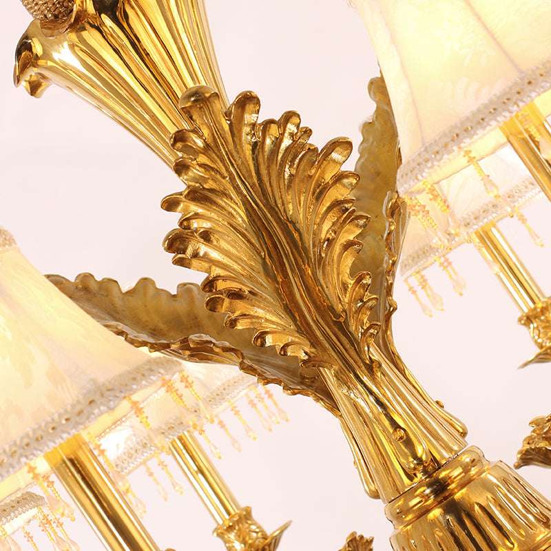 Detailed brass framework of the vintage gold chandelier with fabric accents