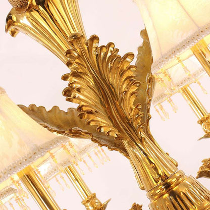 Detailed brass framework of the vintage gold chandelier with fabric accents