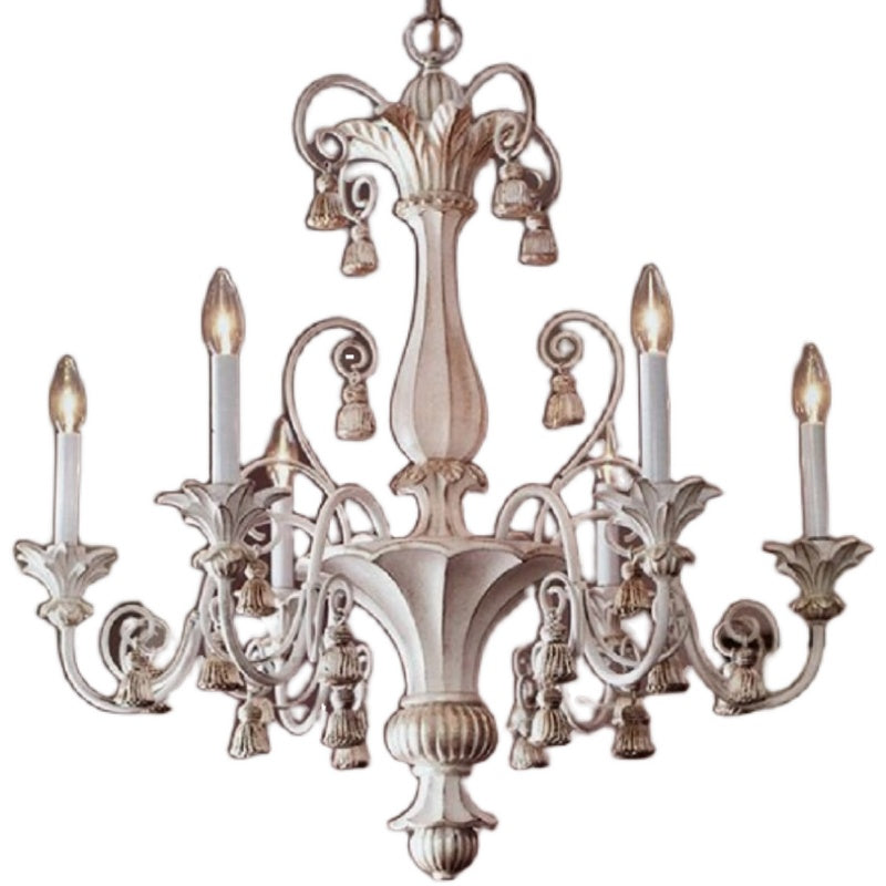Close-up of hand-forged floral metalwork and Edison bulbs on rustic chandelier