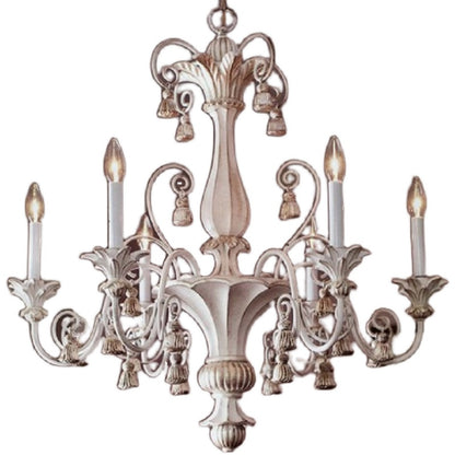 Close-up of hand-forged floral metalwork and Edison bulbs on rustic chandelier