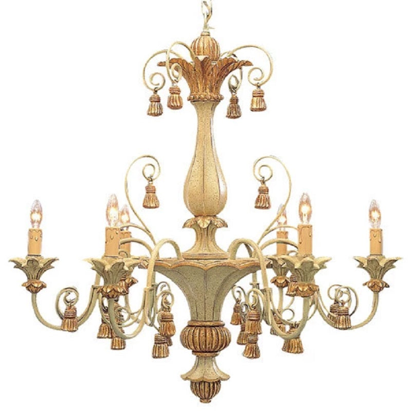 Rustic chandelier casting warm amber glow over a farmhouse dining table